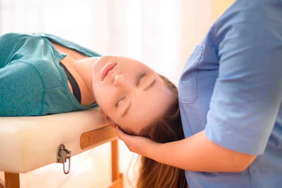 Woman having a neck chiropractic treatment - Chiropractor for Neck Pain Relief in Louisville, KY Woman having a neck chiropractic treatment - Chiropractor for Neck Pain Relief in Louisville, KY