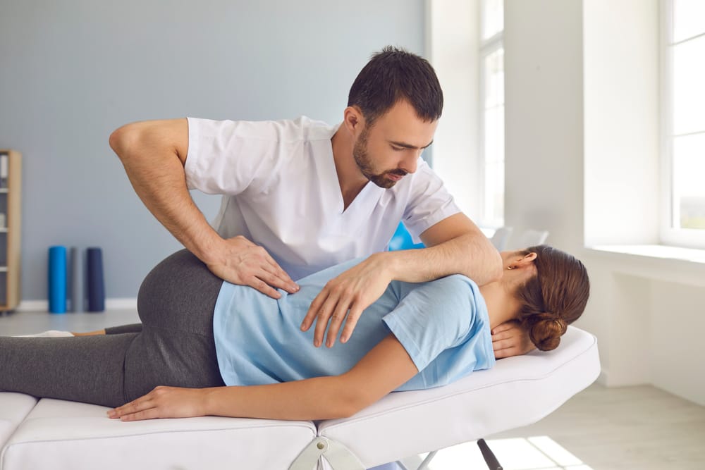 Spinal Alignment Therapy - Manual Adjustment A chiropractor provides a spinal alignment technique to enhance mobility, ease discomfort, and promote overall back health - Manual Adjustment.