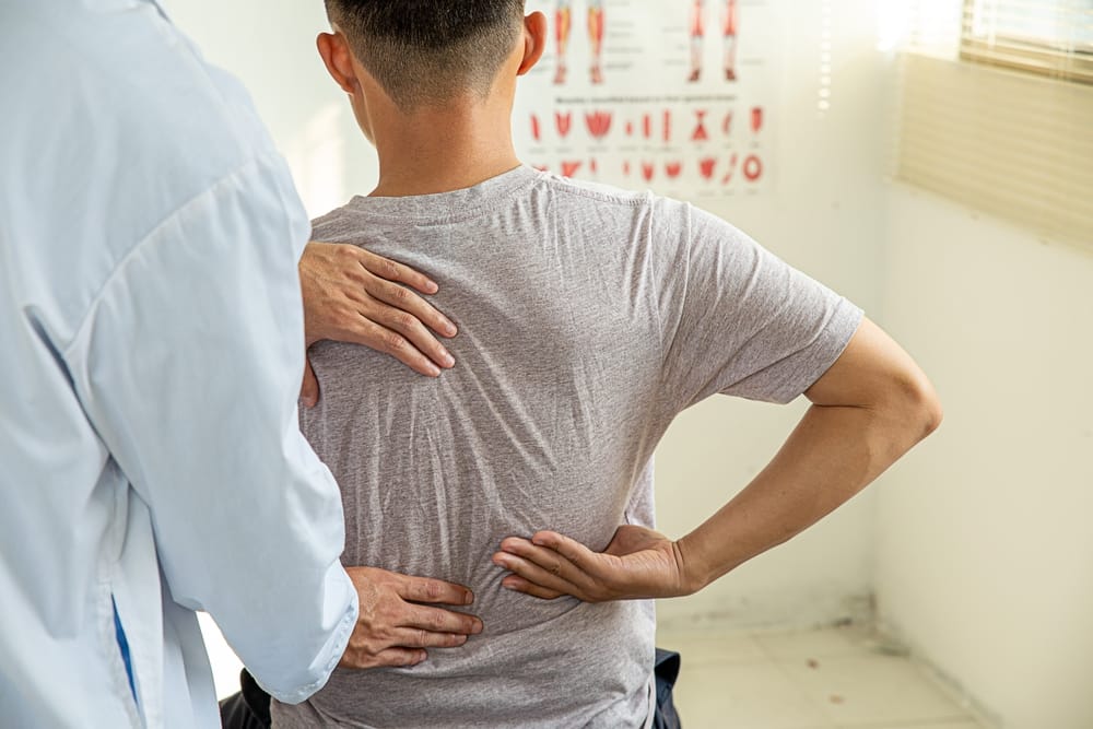 Chiropractic Back Examination – Louisville Auto Accident Chiropractor A chiropractor assesses a patient’s spine and lower back to identify pain and alignment issues after an auto accident – Louisville Auto Accident Chiropractor.