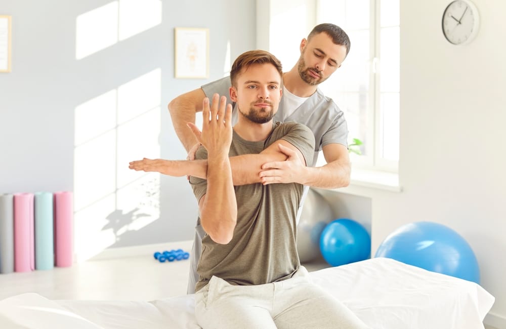 Chiropractic Shoulder Adjustment – Louisville Auto Accident Chiropractor A chiropractor performs a guided stretch and shoulder adjustment to restore mobility and relieve post-accident muscle tension – Louisville Auto Accident Chiropractor.